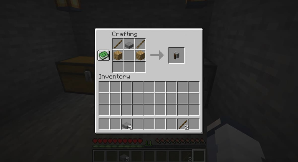 The crafting recipe for a Grindstone.