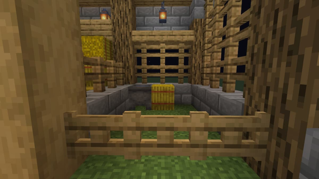 Customizing each of the horse stalls with water cauldrons and hay bales.