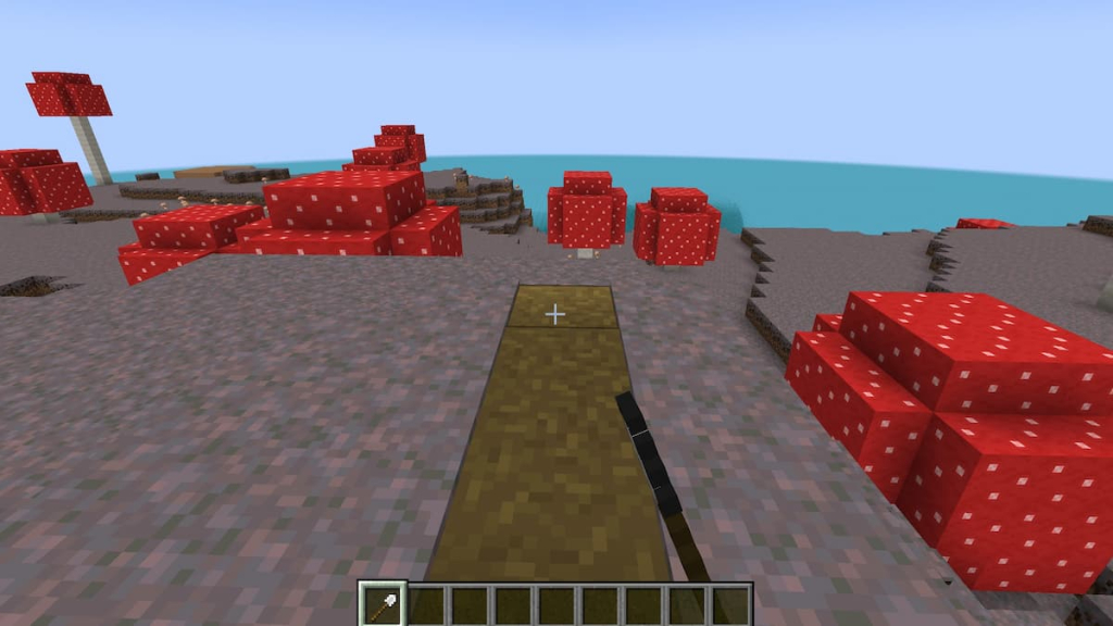 Using a shovel to turn Mycelium into dirt path blocks in Minecraft.